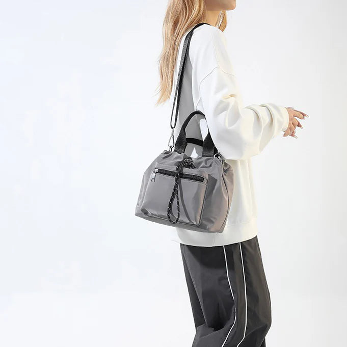 Tone Solid Gathered Bucket Carry Pouch with Dual Carry Fixtures and Front Zip Slip