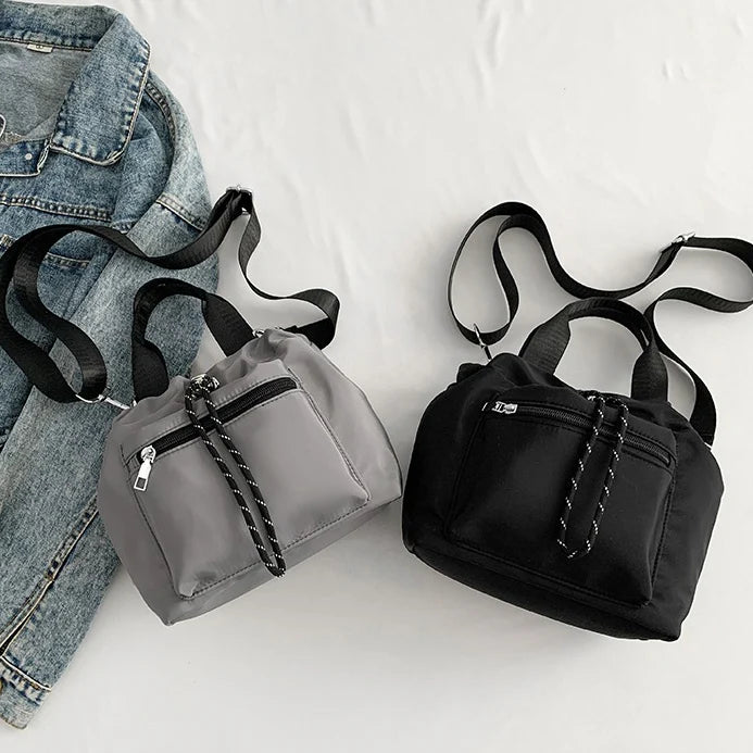 Tone Solid Gathered Bucket Carry Pouch with Dual Carry Fixtures and Front Zip Slip