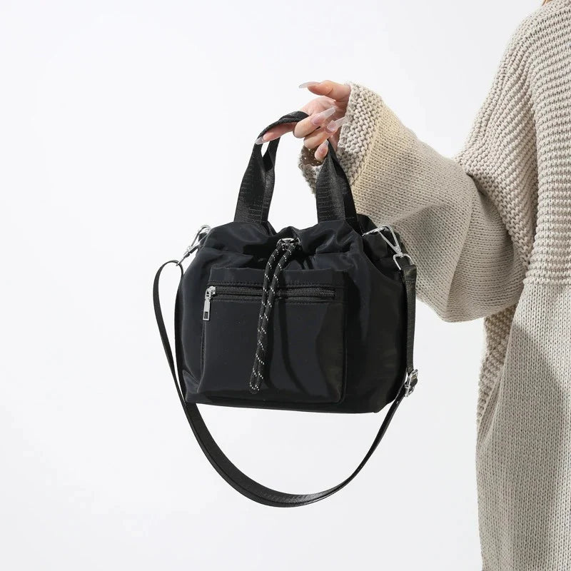 Tone Solid Gathered Bucket Carry Pouch with Dual Carry Fixtures and Front Zip Slip