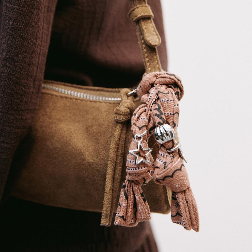Warm Tan Slim Rectangular Arm Carrier with Knotted Fabric Ornament and Star Charms